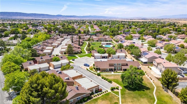 aerial view of residential area featuring a mountainous background