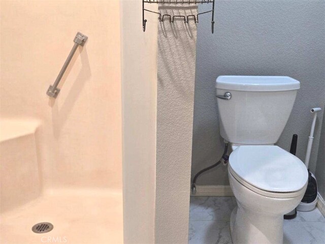 full bathroom with toilet and a shower