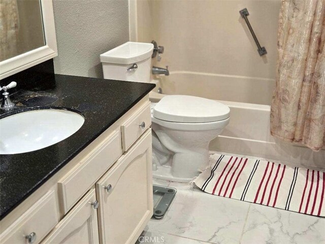 full bath with shower / bathtub combination with curtain, vanity, toilet, and a textured wall