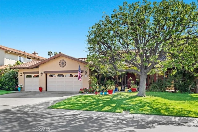 31271 Via Fajita, San Juan Capistrano, CA 92675 - view of front facade with an attached garage, driveway, stucco siding, a front yard, and a tiled roof