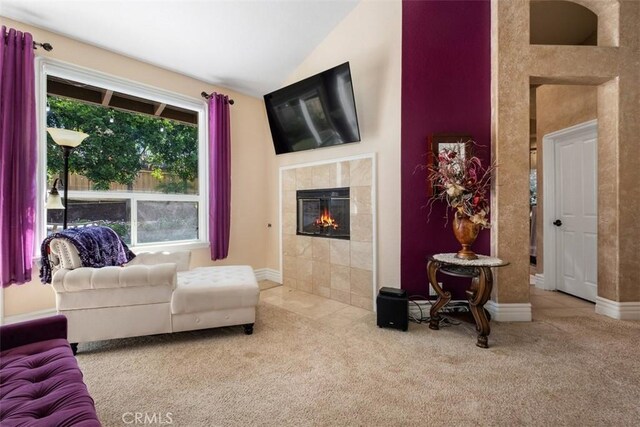 31271 Via Fajita, San Juan Capistrano, CA 92675 - living area with carpet, a tiled fireplace, and lofted ceiling