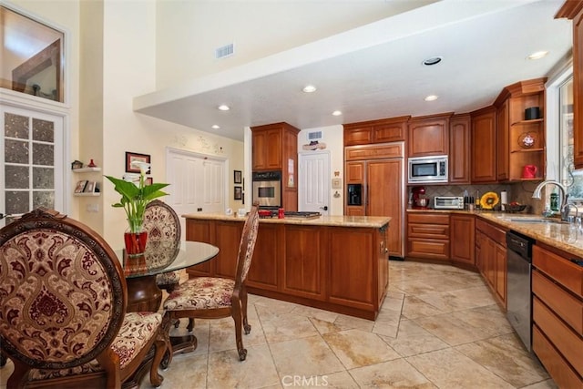 31271 Via Fajita, San Juan Capistrano, CA 92675 - kitchen with built in appliances, decorative backsplash, open shelves, recessed lighting, and brown cabinetry