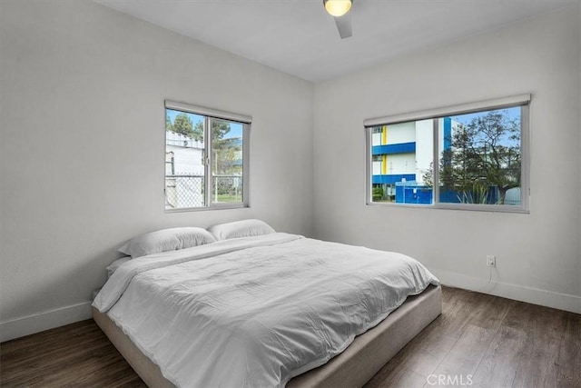 354 E 111th St, Los Angeles, CA 90061 - bedroom featuring wood finished floors, baseboards, and a ceiling fan
