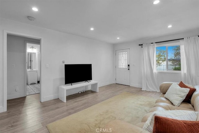 354 E 111th St, Los Angeles, CA 90061 - living area with light wood-style floors, recessed lighting, and baseboards
