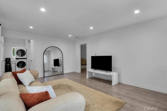 354 E 111th St, Los Angeles, CA 90061 - living room with stacked washer / dryer, recessed lighting, wood finished floors, and baseboards