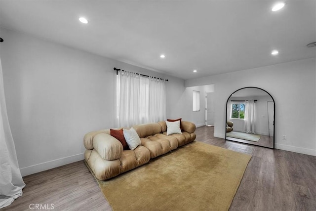 354 E 111th St, Los Angeles, CA 90061 - living area with recessed lighting, baseboards, wood finished floors, and arched walkways