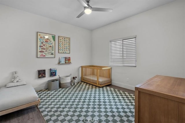 354 E 111th St, Los Angeles, CA 90061 - bedroom featuring baseboards, tile patterned floors, ceiling fan, and a crib