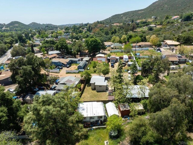 124246 Willowside, Alpine, CA 91901 - aerial overview of property's location featuring a mountain backdrop and nearby suburban area