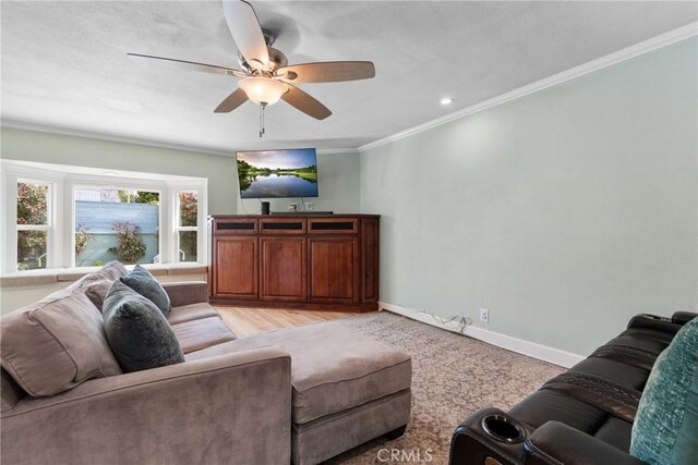 6911 E 10th St, Long Beach, CA 90815 - living room with crown molding, ceiling fan, and baseboards