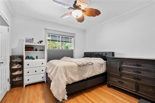 6911 E 10th St, Long Beach, CA 90815 - bedroom featuring crown molding, light wood-style flooring, and ceiling fan
