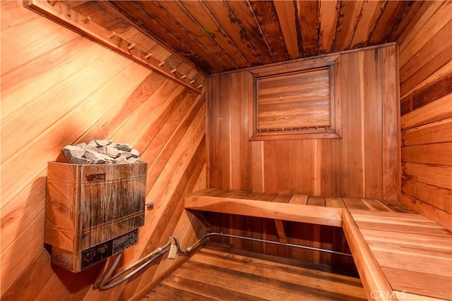 sauna / steam room featuring wood ceiling and wooden walls