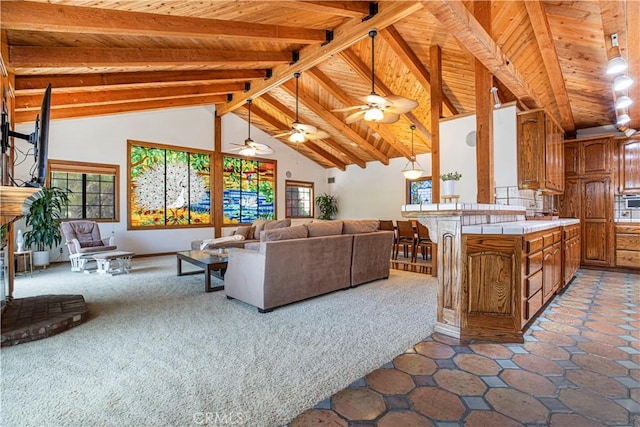 living area with wood ceiling, high vaulted ceiling, beamed ceiling, and a ceiling fan