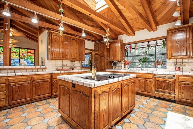 kitchen featuring black electric stovetop, a kitchen island, tasteful backsplash, tile counters, and wooden ceiling
