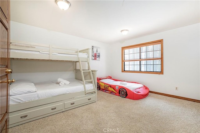 carpeted bedroom with baseboards