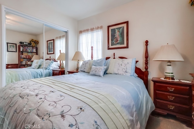 carpeted bedroom with a closet