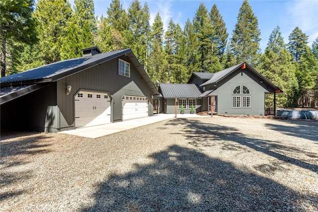 8269 Lost Mill Rd, Shingletown, CA 96088 - view of front of house with gravel driveway and metal roof