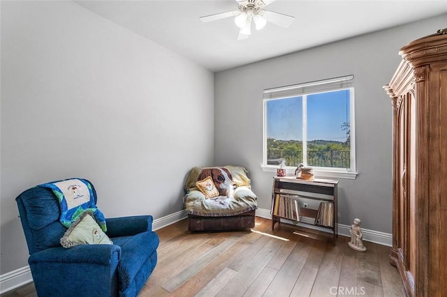 41653 Oak Trail Ct, Murrieta, CA 92562 - sitting room featuring wood finished floors, baseboards, and a ceiling fan