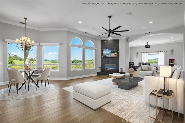 41653 Oak Trail Ct, Murrieta, CA 92562 - living area featuring arched walkways, a chandelier, recessed lighting, ceiling fan, and wood finished floors