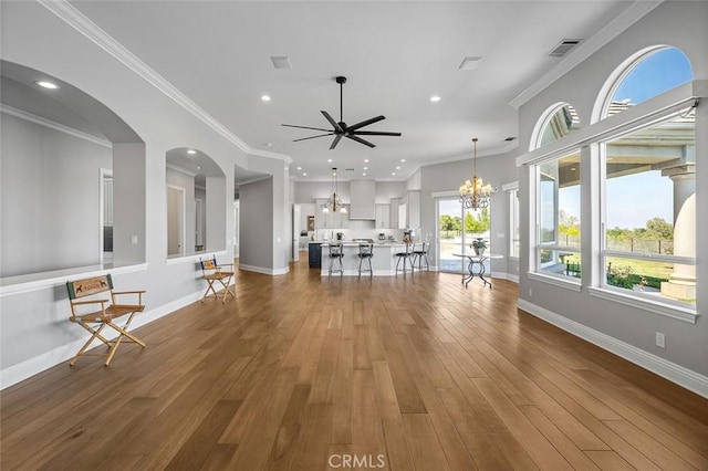 41653 Oak Trail Ct, Murrieta, CA 92562 - unfurnished living room with a chandelier, ceiling fan, wood-type flooring, recessed lighting, and baseboards