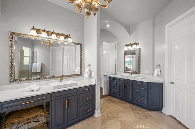 41653 Oak Trail Ct, Murrieta, CA 92562 - full bath with two vanities, a chandelier, and tile patterned flooring