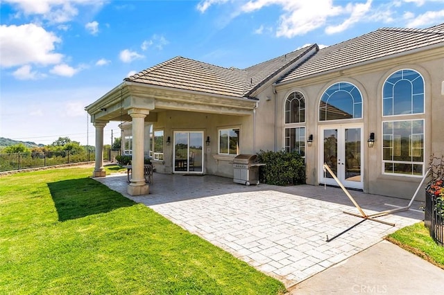 41653 Oak Trail Ct, Murrieta, CA 92562 - rear view of property featuring french doors, a tiled roof, a patio, and stucco siding