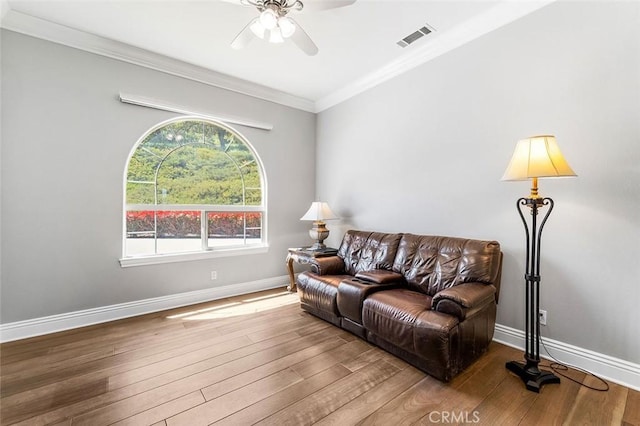 41653 Oak Trail Ct, Murrieta, CA 92562 - living room featuring a ceiling fan, wood finished floors, ornamental molding, and baseboards