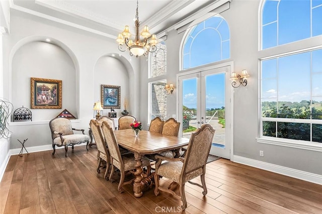 41653 Oak Trail Ct, Murrieta, CA 92562 - dining space with a chandelier, dark wood finished floors, crown molding, baseboards, and french doors