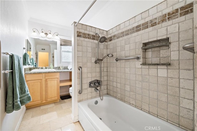 full bath featuring ornamental molding, washtub / shower combination, vanity, baseboards, and stone finish flooring