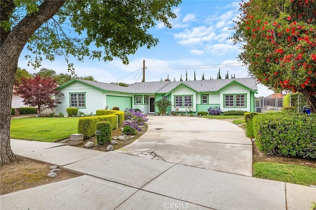 ranch-style house with a garage and concrete driveway