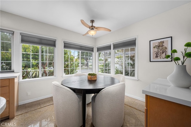 3113 San Anseline Ave, Long Beach, CA 90808 - dining space with baseboards, ceiling fan, and healthy amount of natural light