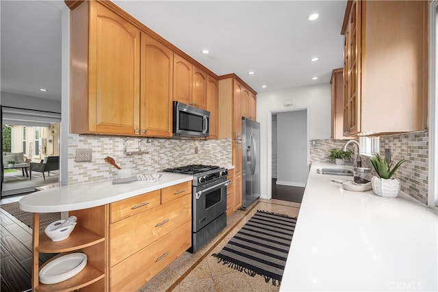 3113 San Anseline Ave, Long Beach, CA 90808 - kitchen with stainless steel appliances, a sink, recessed lighting, light countertops, and decorative backsplash