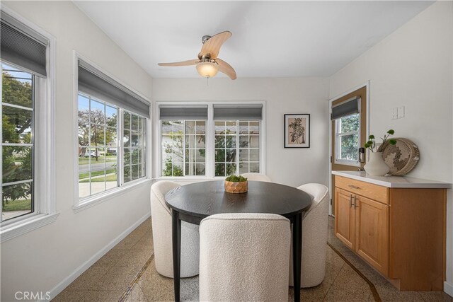 3113 San Anseline Ave, Long Beach, CA 90808 - dining space with baseboards and a ceiling fan