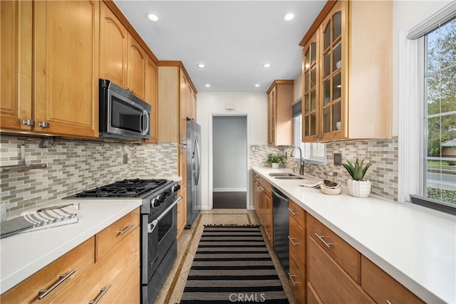 3113 San Anseline Ave, Long Beach, CA 90808 - kitchen with stainless steel appliances, a sink, recessed lighting, baseboards, and light countertops
