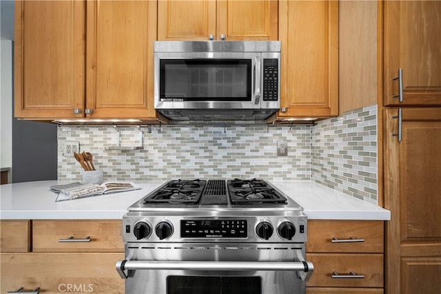 3113 San Anseline Ave, Long Beach, CA 90808 - kitchen with appliances with stainless steel finishes, light countertops, backsplash, and brown cabinets
