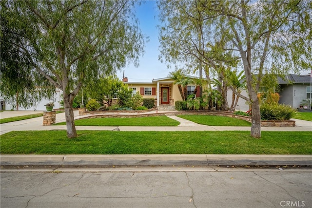 3113 San Anseline Ave, Long Beach, CA 90808 - view of front of home with a front lawn, concrete driveway, and stucco siding
