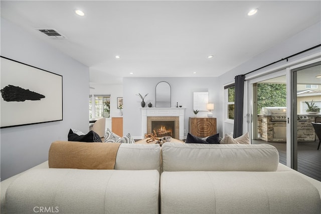 3113 San Anseline Ave, Long Beach, CA 90808 - living area featuring recessed lighting, healthy amount of natural light, wood finished floors, and a lit fireplace