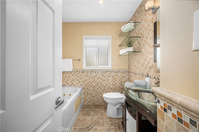 3113 San Anseline Ave, Long Beach, CA 90808 - full bathroom featuring tile walls, a whirlpool tub, tile patterned floors, toilet, and vanity