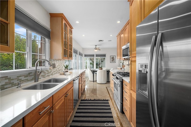 3113 San Anseline Ave, Long Beach, CA 90808 - kitchen with stainless steel appliances, a sink, granite tiled floors, a ceiling fan, and tasteful backsplash