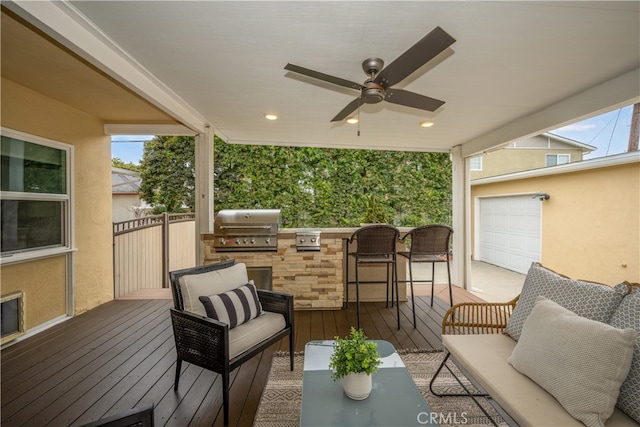 3113 San Anseline Ave, Long Beach, CA 90808 - wooden deck with exterior kitchen, a grill, an outdoor hangout area, a ceiling fan, and a garage