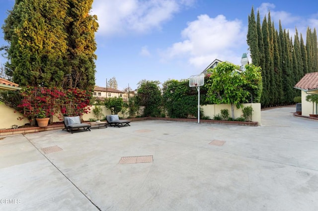 view of patio featuring fence