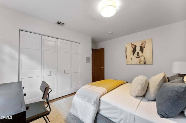 bedroom featuring a closet and wood finished floors