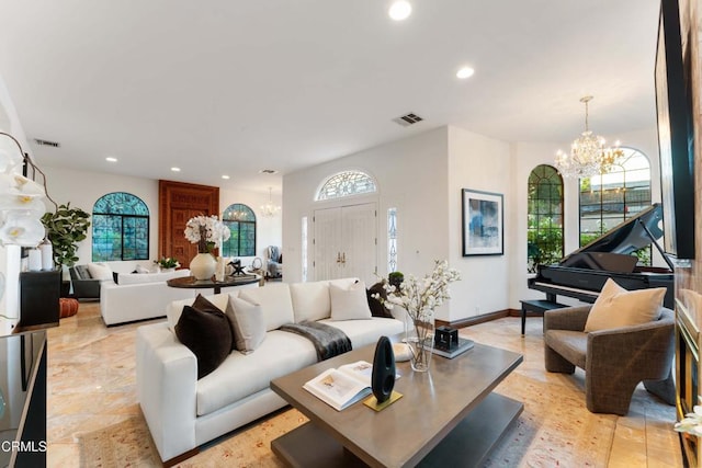 living area with a chandelier and recessed lighting
