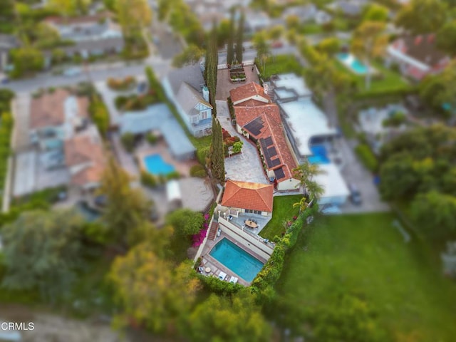 view of subject property with a pool area