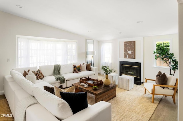 12091 Pine St, Los Alamitos, CA 90720 - living room with vaulted ceiling, a fireplace with flush hearth, and baseboards