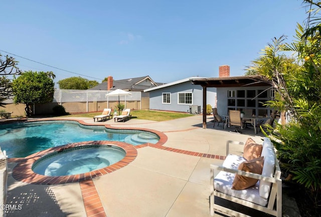 12091 Pine St, Los Alamitos, CA 90720 - view of pool with a patio, a fenced backyard, a pool with connected hot tub, and outdoor dining space