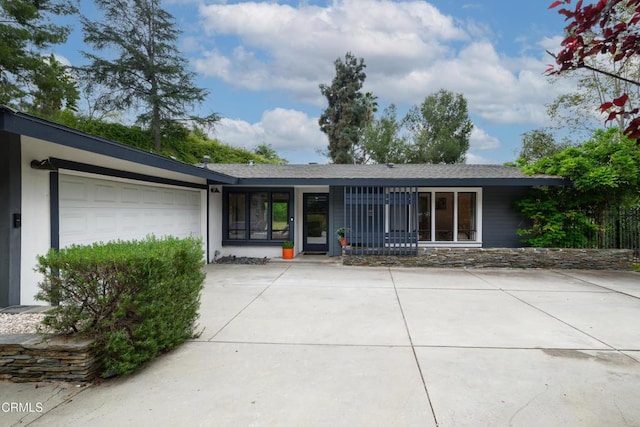 1445 Washburn Rd, Pasadena, CA 91105 - property entrance with driveway and an attached garage