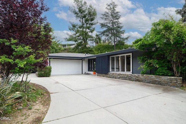 1445 Washburn Rd, Pasadena, CA 91105 - view of front of house featuring a garage and concrete driveway