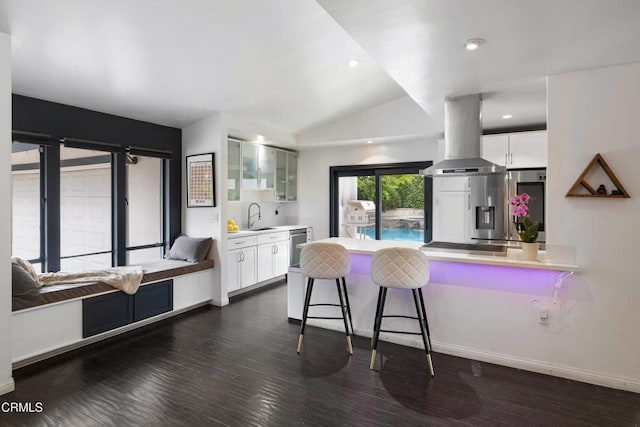 1445 Washburn Rd, Pasadena, CA 91105 - kitchen featuring island exhaust hood, a sink, a peninsula, a breakfast bar area, and appliances with stainless steel finishes