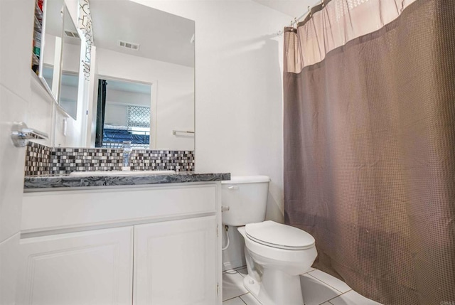 1445 Suwerte Ave Unit 4, Chula Vista, CA 91915 - bathroom with decorative backsplash, toilet, vanity, tile patterned floors, and curtained shower