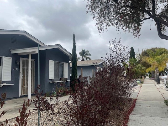 view of property exterior with stucco siding